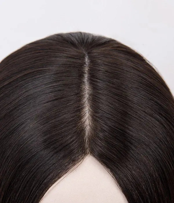 Close-up of a silk top topper parting with concealed knots